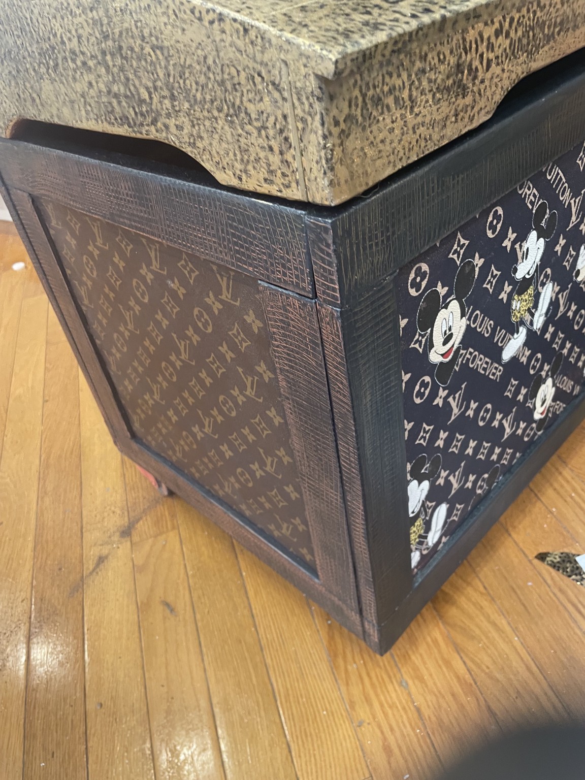 Designer chest during its transformation with a patterned front and textured gold top