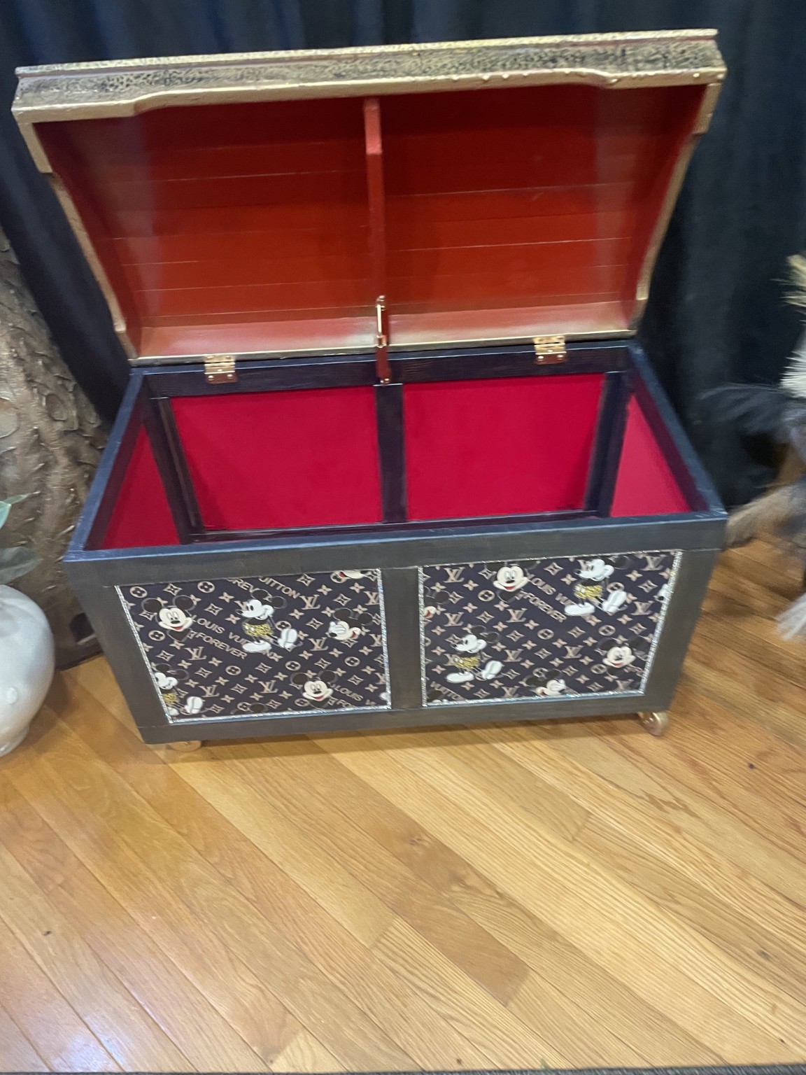 Open view of the custom cabinet showing its vivid red finished interior