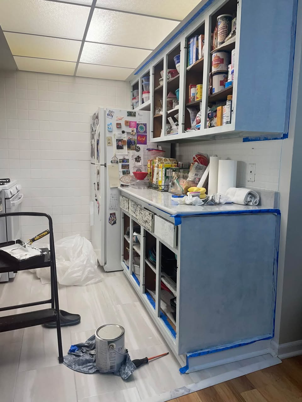 Kitchen cabinets carefully prepared and painted during the MOMO Designs refresh