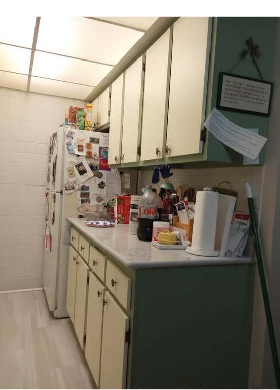 Kitchen cabinets and counter before the MOMO Designs paint and hardware transformation