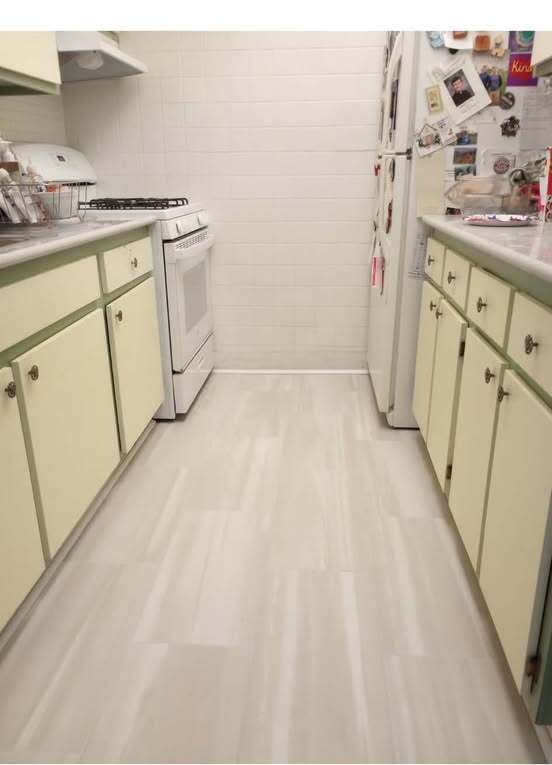 Full galley kitchen before the cabinet painting, new hardware, tile glazing, and ceiling refresh