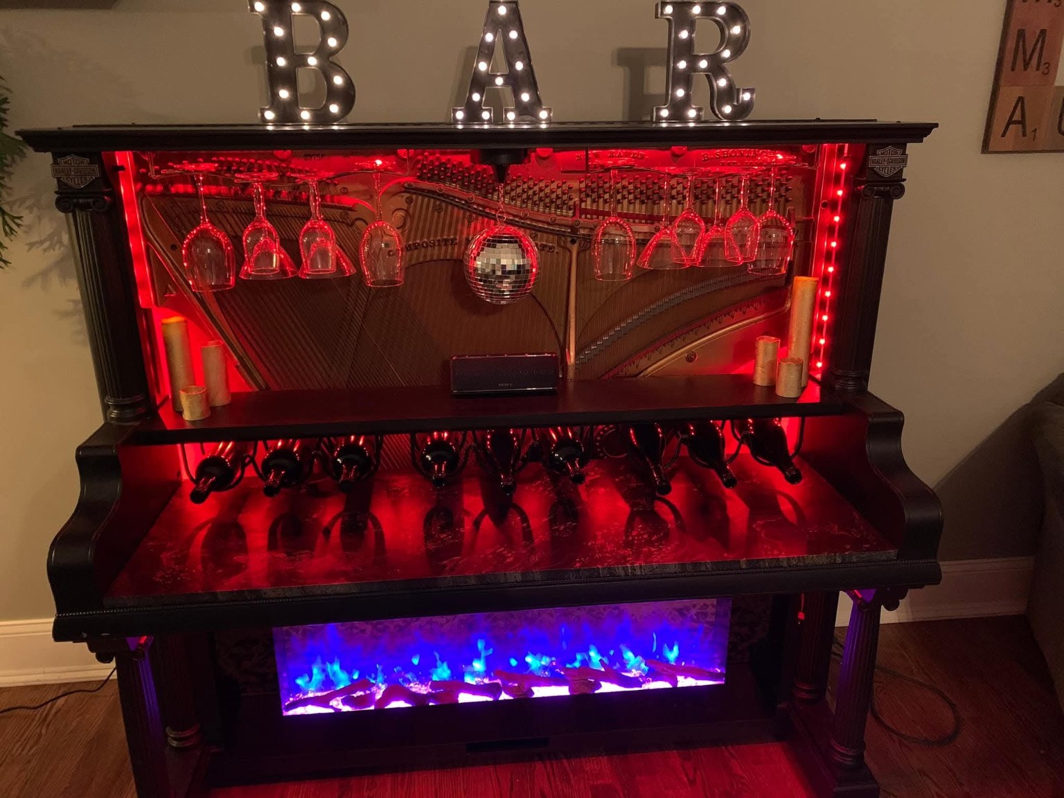 Custom piano bar illuminated with red accent lighting