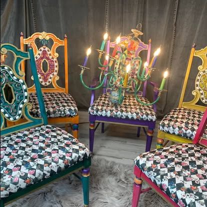Colorfully painted statement chairs with patterned upholstery