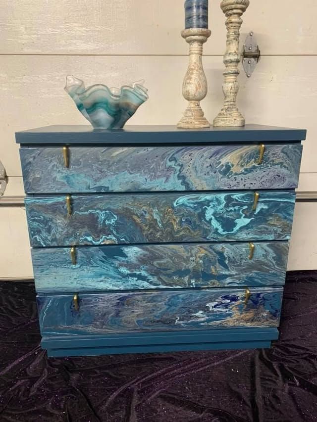 Blue dresser with hand-painted waves, fish, and aquatic details