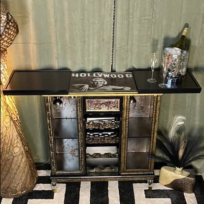 Finished Hollywood-inspired black and gold bar cabinet