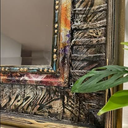 Close detail of a richly textured hand-finished mirror frame