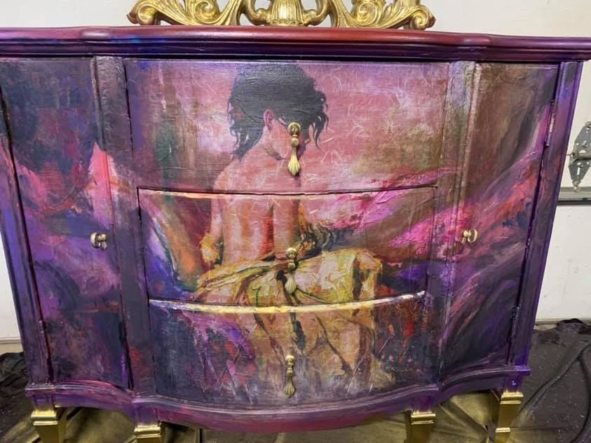 Purple art cabinet with a hand-painted portrait and gold details